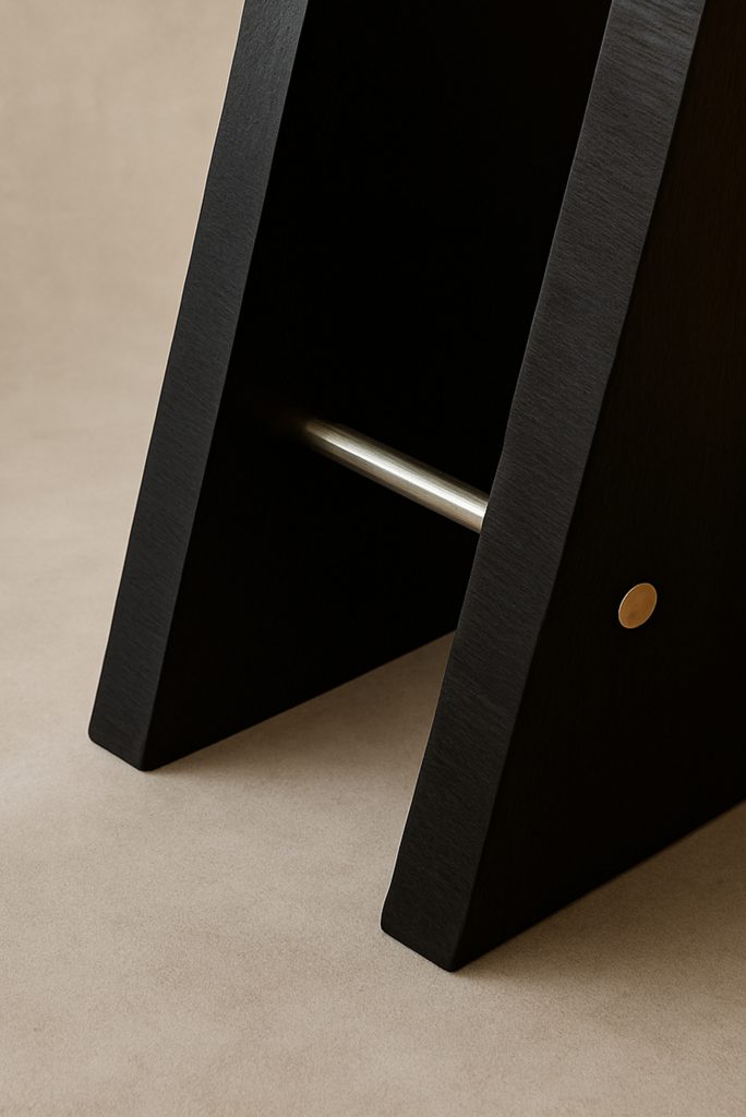 Detail of metallic finishes on Jolie table base in onyge black veneer by Monography