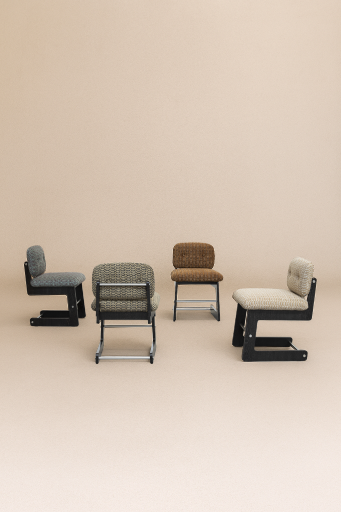 Group of Mirelle chairs in multiple fabric tones and textures — modern Italian chairs designed by Monography, handcrafted in solid wood.