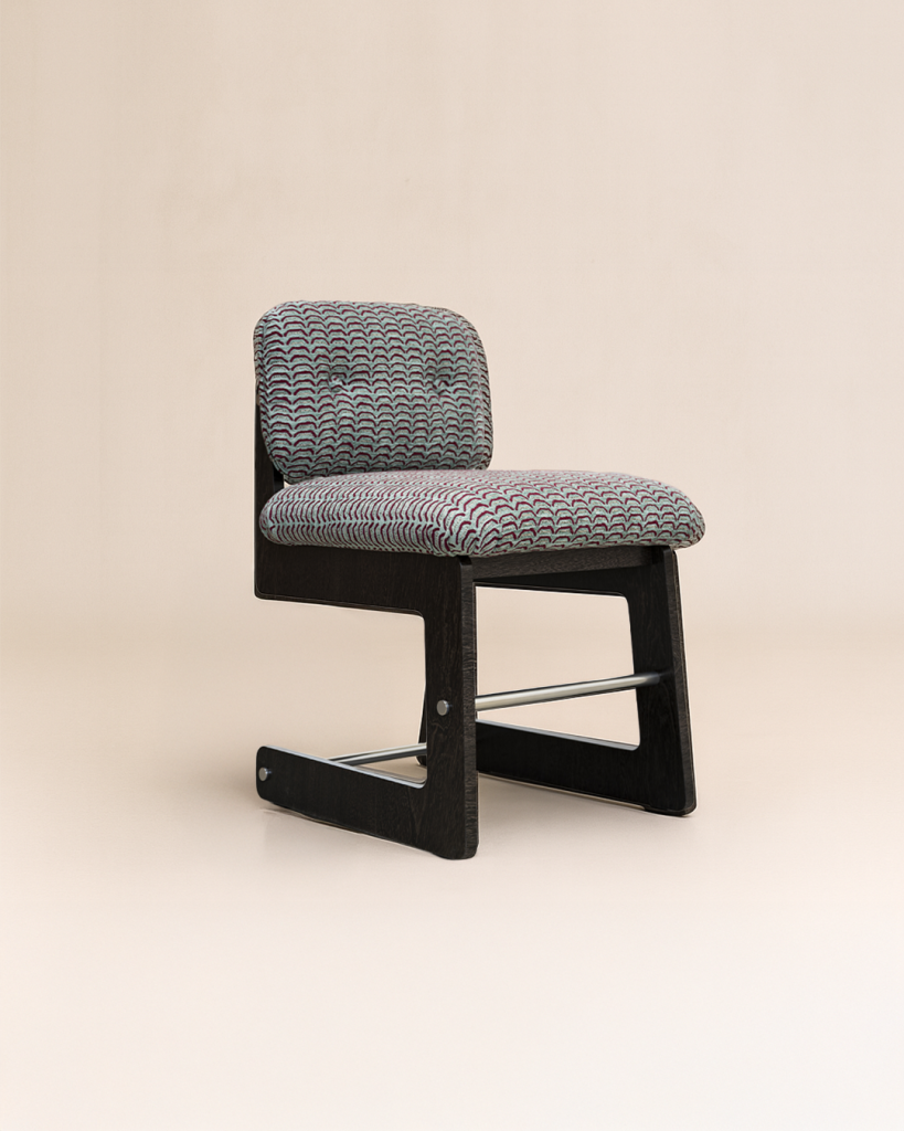 Mirelle chair photographed in studio on neutral background — refined proportions, solid wood structure, and tactile upholstery by Monography.